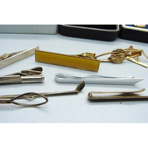 887 - A large bag of cufflinks and tie pins