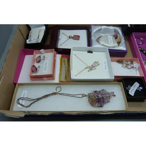 915 - A collection of silver mounted jewellery; earrings, necklaces pendants and chains