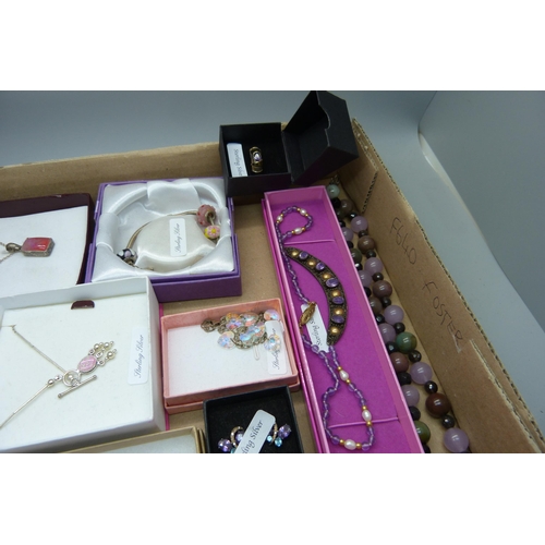 915 - A collection of silver mounted jewellery; earrings, necklaces pendants and chains