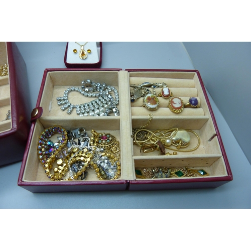 916 - A case of costume jewellery including tigers eye and amethyst quartz pendants