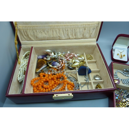 916 - A case of costume jewellery including tigers eye and amethyst quartz pendants