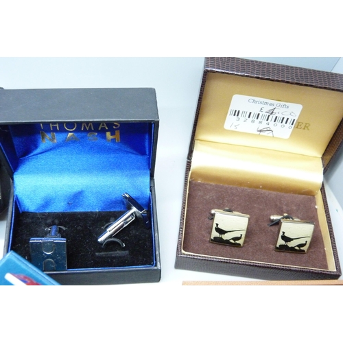 922 - A collection of tie pins and cufflinks including Star Trek and Swarovski, mainly boxed