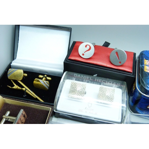 922 - A collection of tie pins and cufflinks including Star Trek and Swarovski, mainly boxed