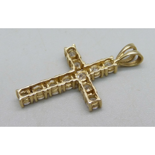 933 - A 9ct gold cross pendant set with white stones, 2.2g, 3cm