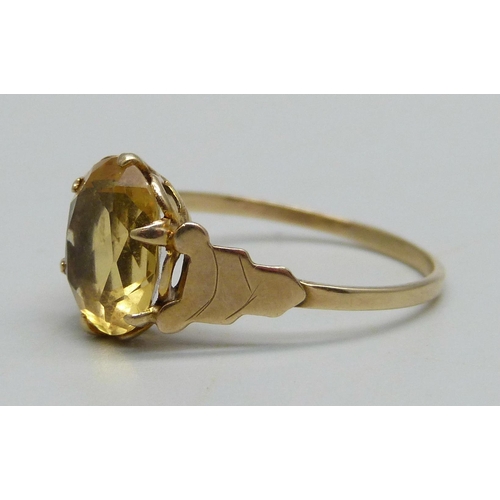 934 - A yellow metal ring set with a citrine, 1.69g, Q