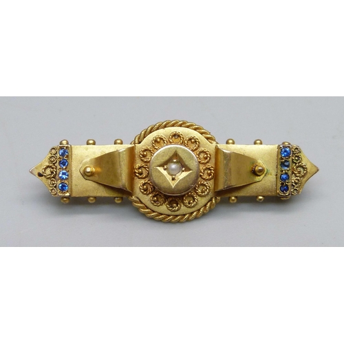 935 - A 9ct gold bar brooch, set with eight blue stones and a central pearl, 3.8g, 4cm