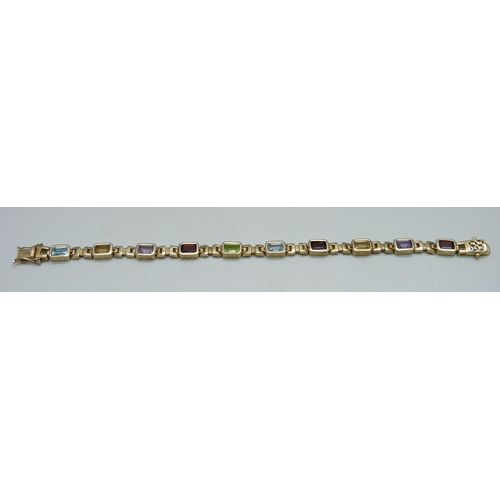 939 - A silver gilt bracelet set with amethyst, citrine, garnet and topaz, 19cm