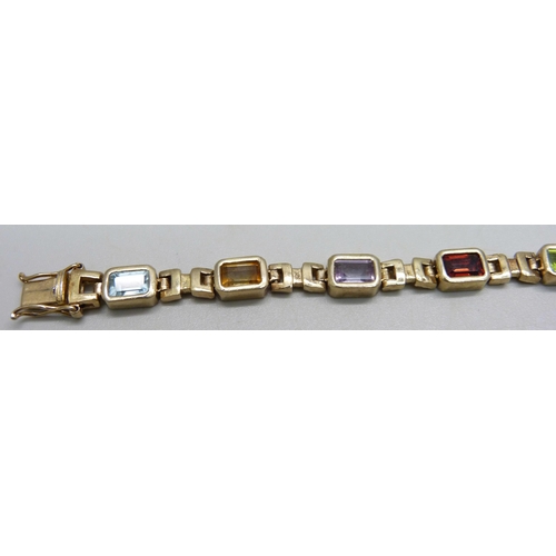 939 - A silver gilt bracelet set with amethyst, citrine, garnet and topaz, 19cm