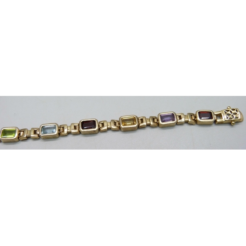 939 - A silver gilt bracelet set with amethyst, citrine, garnet and topaz, 19cm