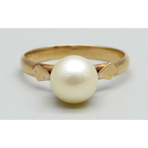 945 - A yellow metal ring set with a pearl, 2.82g, P, stamps to outer shank, pearl re-glued