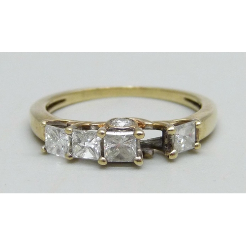 946 - A 9ct gold ring set with six diamonds (one missing), 2.1g, O