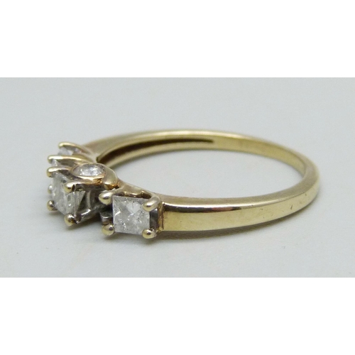 946 - A 9ct gold ring set with six diamonds (one missing), 2.1g, O