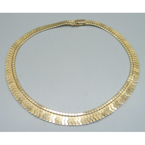 947 - An 18ct gold flat snake link collar necklace, stamped 750 on the clasp, 42.5cm, 43.9g