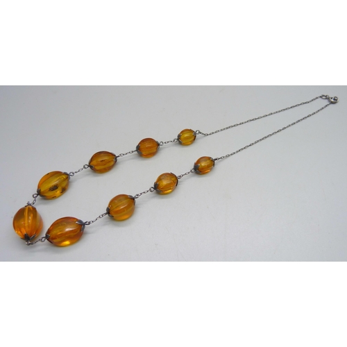 958 - A vintage Russian 875 silver and natural amber bead necklet with Russian hallmarks, approximately 54... 