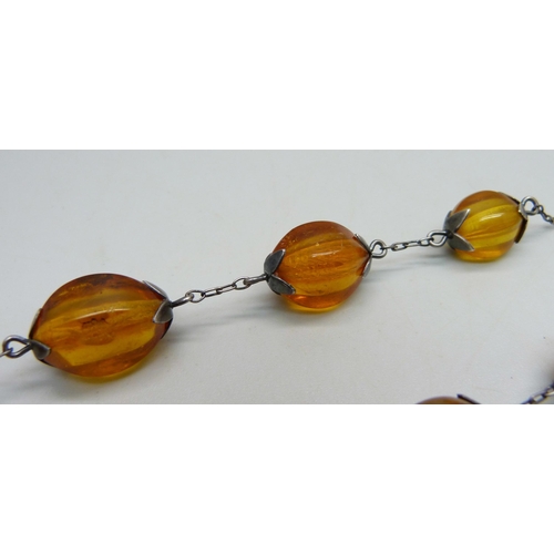 958 - A vintage Russian 875 silver and natural amber bead necklet with Russian hallmarks, approximately 54... 