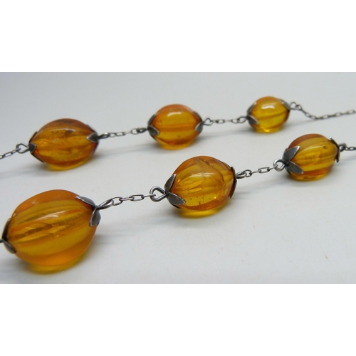 958 - A vintage Russian 875 silver and natural amber bead necklet with Russian hallmarks, approximately 54... 