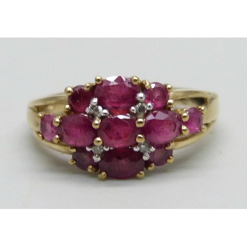 963 - A 9ct gold ring set with rubies and diamonds, 2.4g, K