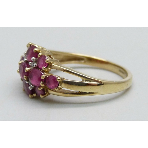 963 - A 9ct gold ring set with rubies and diamonds, 2.4g, K