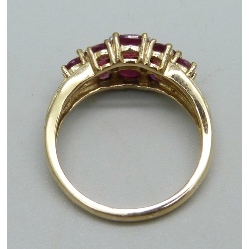 963 - A 9ct gold ring set with rubies and diamonds, 2.4g, K