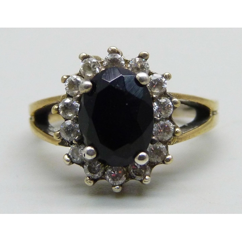 966 - A silver gilt cluster ring set with a a black stone and cubic zirconia halo, M