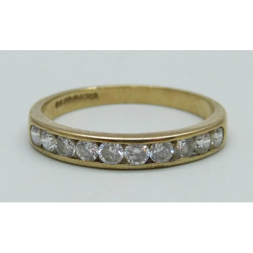 983 - A 9ct gold ring set with ten white stones, 1.9g, R