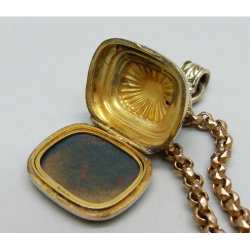 991 - An antique 9ct gold long guard chain and a 9ct gold secret locket fob, initials to bloodstone seal, ... 