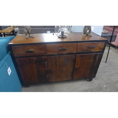 1408 - An industrial style hardwood and metal three door, three drawer cabinet on wheels * this lot is subj... 