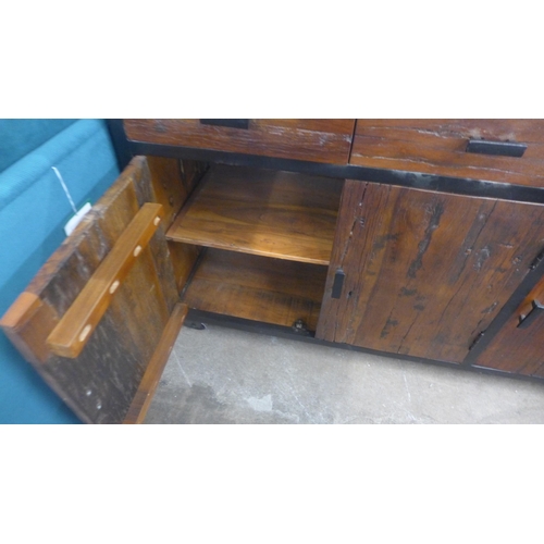 1408 - An industrial style hardwood and metal three door, three drawer cabinet on wheels * this lot is subj... 