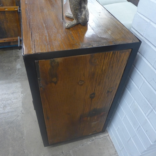 1408 - An industrial style hardwood and metal three door, three drawer cabinet on wheels * this lot is subj... 