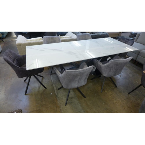 1428 - A Kos 130cm - 180cm extending dining table and a Harlequin set of six grey velvet dining chairs * Th... 