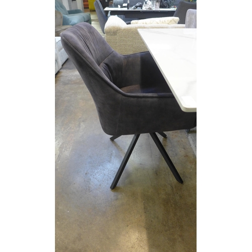 1428 - A Kos 130cm - 180cm extending dining table and a Harlequin set of six grey velvet dining chairs * Th... 