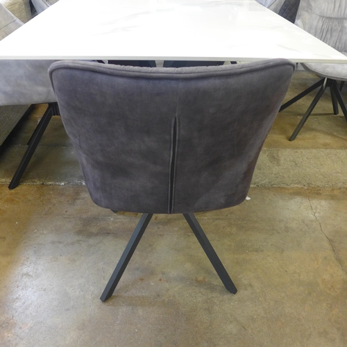 1428 - A Kos 130cm - 180cm extending dining table and a Harlequin set of six grey velvet dining chairs * Th... 