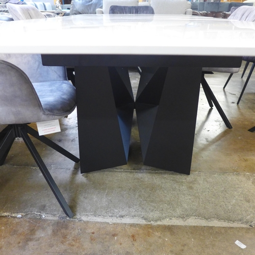 1428 - A Kos 130cm - 180cm extending dining table and a Harlequin set of six grey velvet dining chairs * Th... 