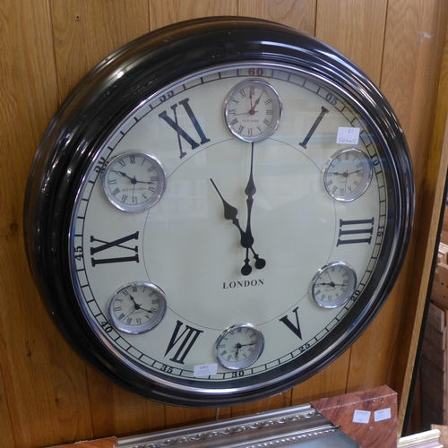 1457 - A 'London' black multi dial clock