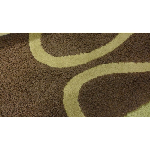 1502 - A large chocolate carpet with beige pattern