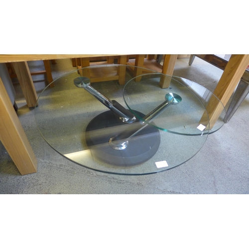 1549 - A glass swivel coffee table