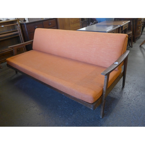 108 - A Guy Rogers teak and orange fabric upholstered sofa bed, designed by Eric Fejer and Eric Phamphilon