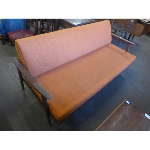 108 - A Guy Rogers teak and orange fabric upholstered sofa bed, designed by Eric Fejer and Eric Phamphilon