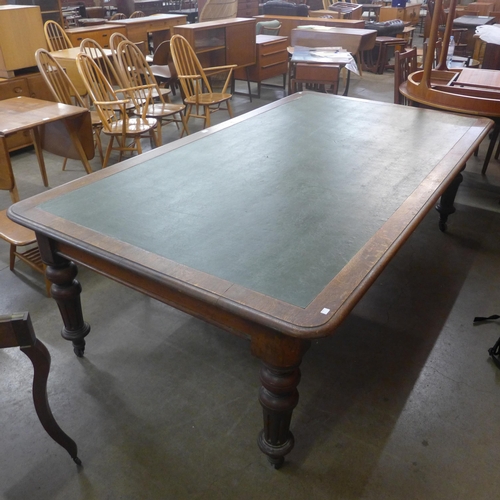 114 - A large early Victorian oak and faux green leather topped library table, 74cms h, 241cms l, 133cms w