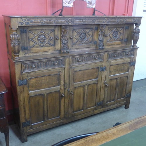 115 - An Elizabethan Revival carved oak court cupboard