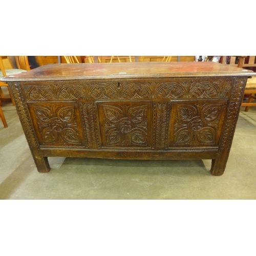 121 - A Charles II carved oak coffer