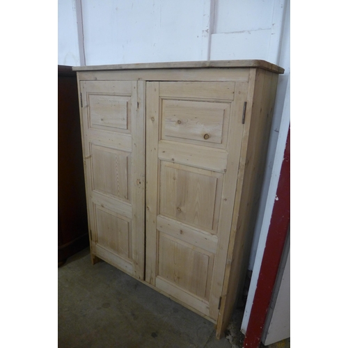 130 - A Victorian pine two door housekeeper's cupboard