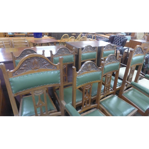 146 - A set of eight Arts and Crafts oak dining chairs