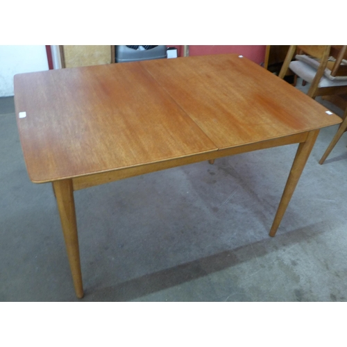 15 - A teak extending dining table