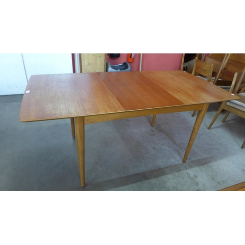 15 - A teak extending dining table