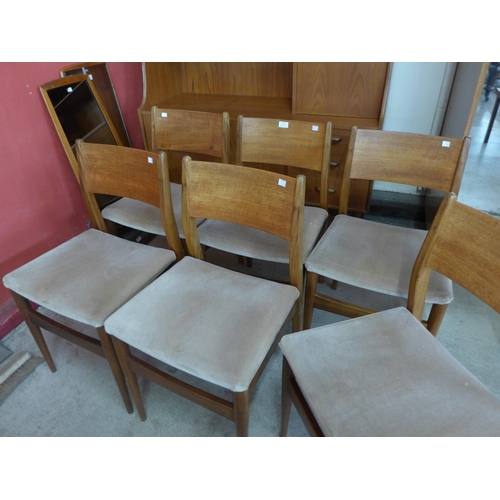 16 - A set of six teak dining chairs