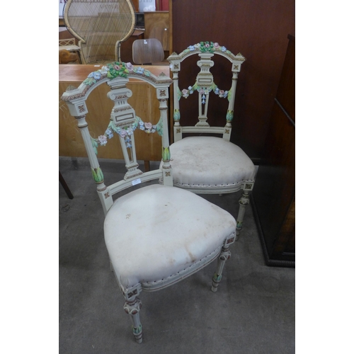 168 - A pair of early 20th Century French Rococo style painted side chairs