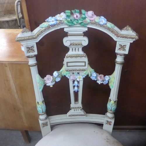 168 - A pair of early 20th Century French Rococo style painted side chairs