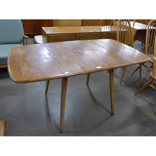 26 - An Ercol Blonde elm and beech Windsor drop-leaf table