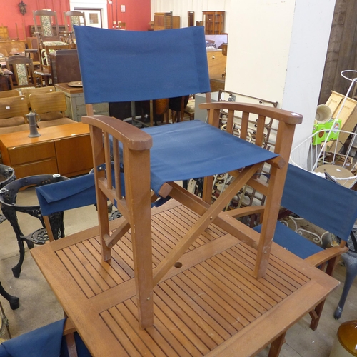 281 - A teak garden table and four chairs